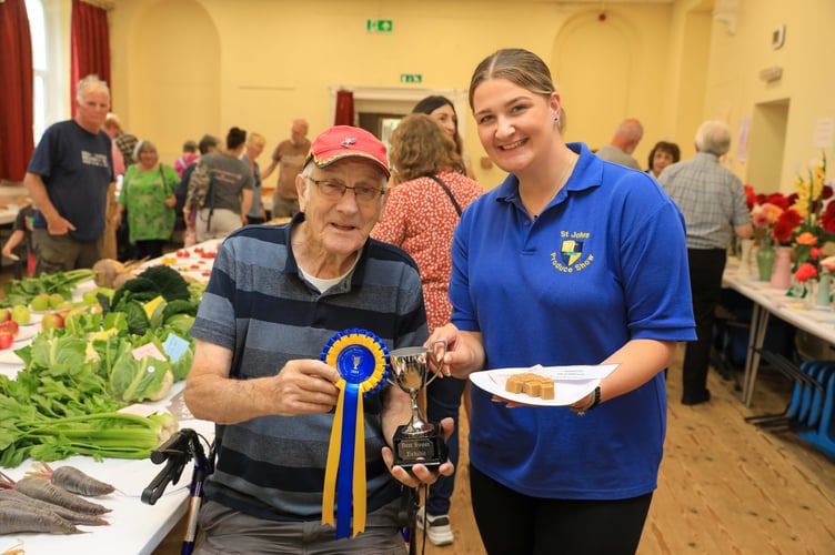 Derek Clarke presenting Anna McKeown with a new trophy (Clarke Cup) for the best sweet exhibit in Show.