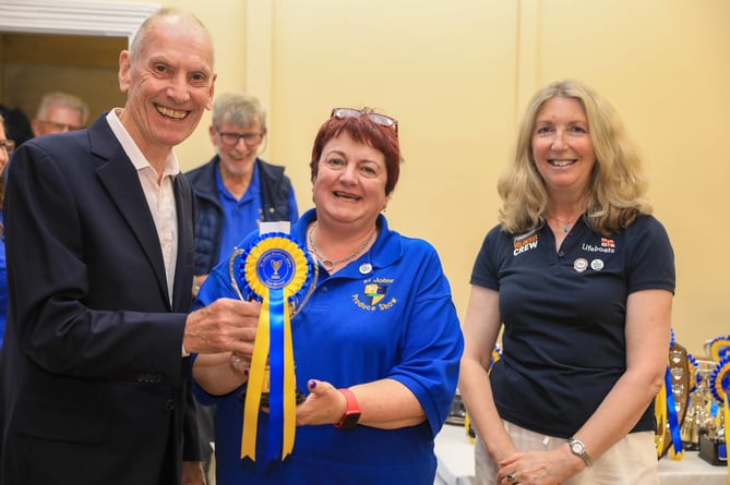 Stuart Lambie (Foxdale Heritage Centre) & Helen Dickinson (Peel RNLI) presenting Sandra Cowell (Middle) with the Michael Goldie Cup. Sandra was collecting on behalf of Rachel Tumelty. 