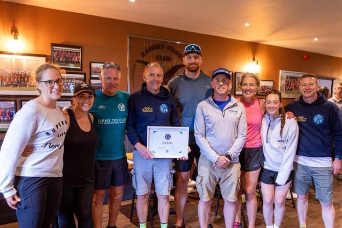 Juan Kinley (fourth from left) was awarded lifetime membership of Manx Tri Club for his unwavering support and dedication to the club (Photo: DK Photography)