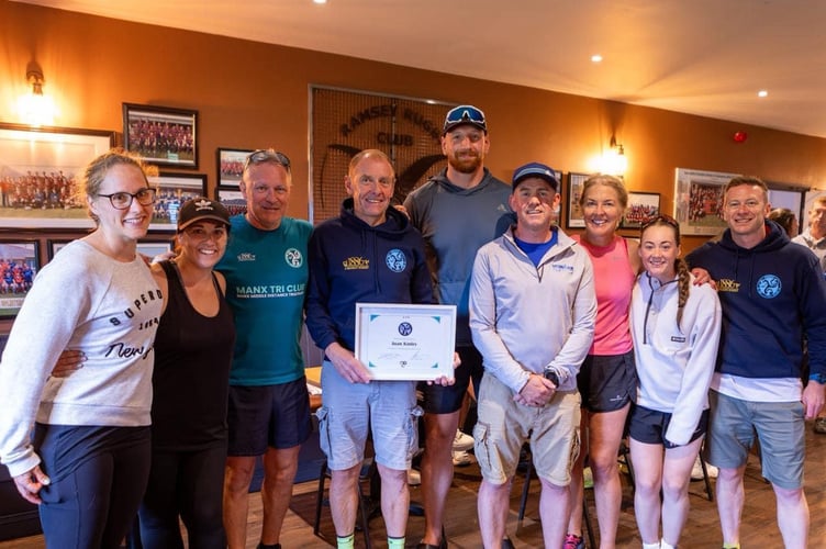 Juan Kinley (fourth from left) was awarded lifetime membership of Manx Tri Club for his unwavering support and dedication to the club (Photo: DK Photography)