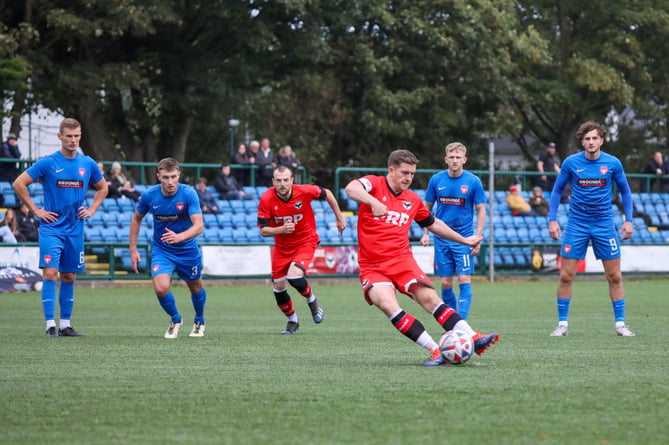 Ste Whitley steps up to fire FC Isle of Man ahead from the penalty spot against Cheadle Town at the Bowl on Saturday evening. Whitley scored a brace to help the Ravens win 2-0 (Photo: Hannah McHugh/FC Isle of Man)