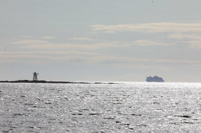 Manxman Celebration cruise in the distance, about to pass Gansey Beach. 