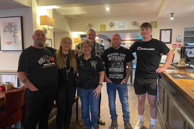 Angela Davies (middle) with some regular TT visitors and her daughter Cara Davies (left) and staff member Jacob Butler (right)