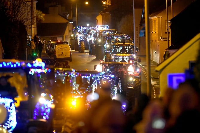 A previous Young Farmers Christmas tractor run passing through Kirk Michael 