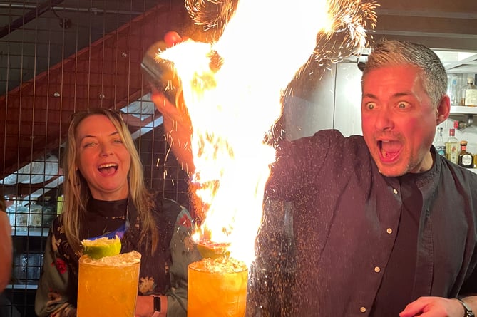 Fastyr Fynoderee - Chloe Woolley and Adam Rhodes enjoy a flaming good Manx cocktail (Photo - Ruth Keggin Gell)