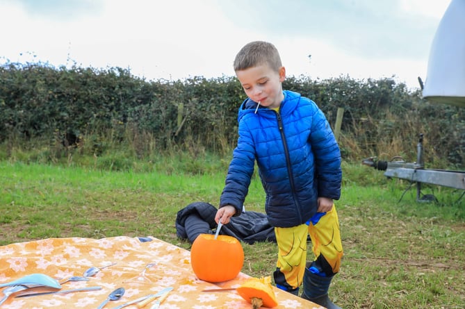 Cian Farrell sizing up his pumpkin