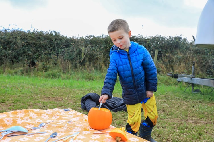 Cian Farrell sizing up his pumpkin