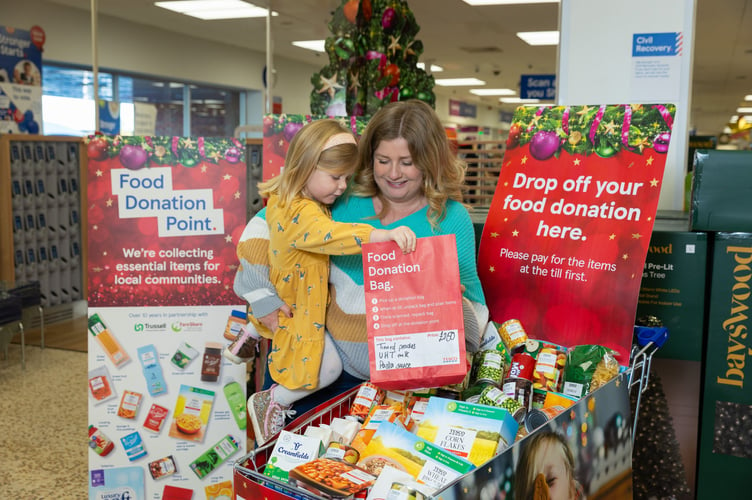 Jess McCulloch with her daughter at a food donation point