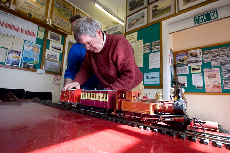 Sam Knight setting up a model Isle of Man Railway back in 2011, which had been donated to the Museum