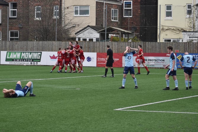 AFC Liverpool celebrate a late winner against FC Isle of Man