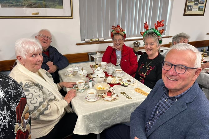 Captain of the Parish of Marown Charles Fargher (right) enjoyed the tea and cakes with well-respected members of the parish 