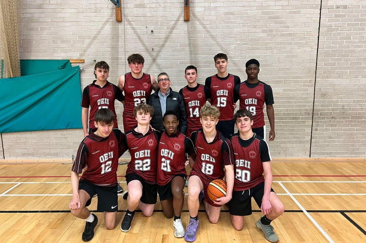 One of the QEII basketball teams with new kit sponsor Ian Davison of Davison's Ice Cream