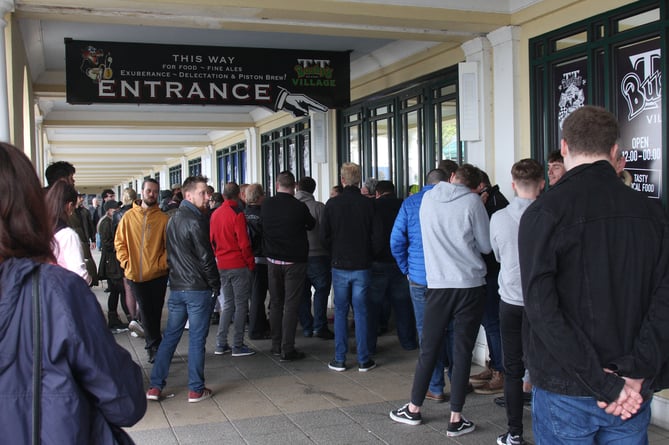 People queue for a while to get in to Bushy's TT Village in the Villa Marina Gardens