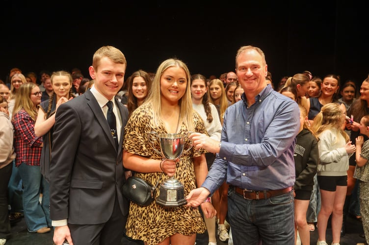 Michael Diehl, Chairman of Isle of Man Young Farmers & Findlay Macleod, Managing Director of Isle of Man Creamery presenting Caitlin McKeown, Chairwoman of Central Young Farmers with the 1st place award. Isle of Man Young Farmers Concert 2025. 